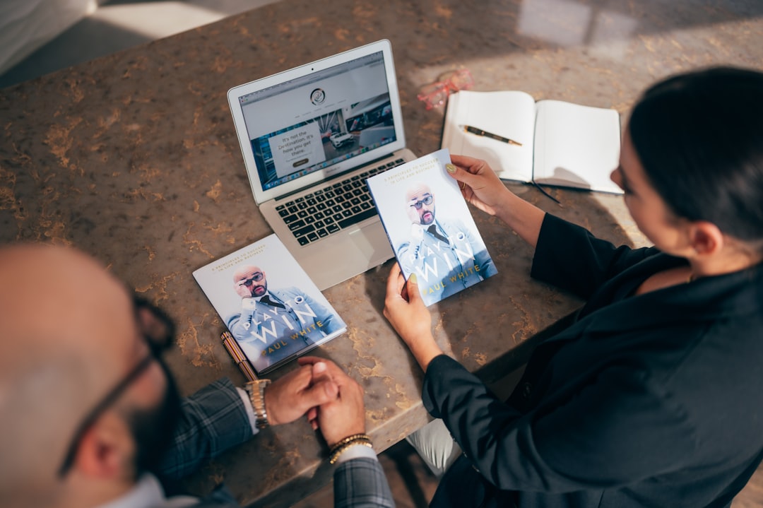 man in black jacket sitting beside woman in black jacket